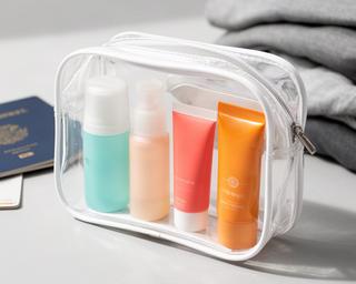 Travel beauty kit in clear pouch with mini bottles and tubes